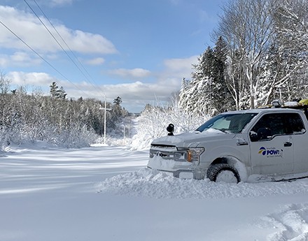 A car parked in a place covered with deep snoow