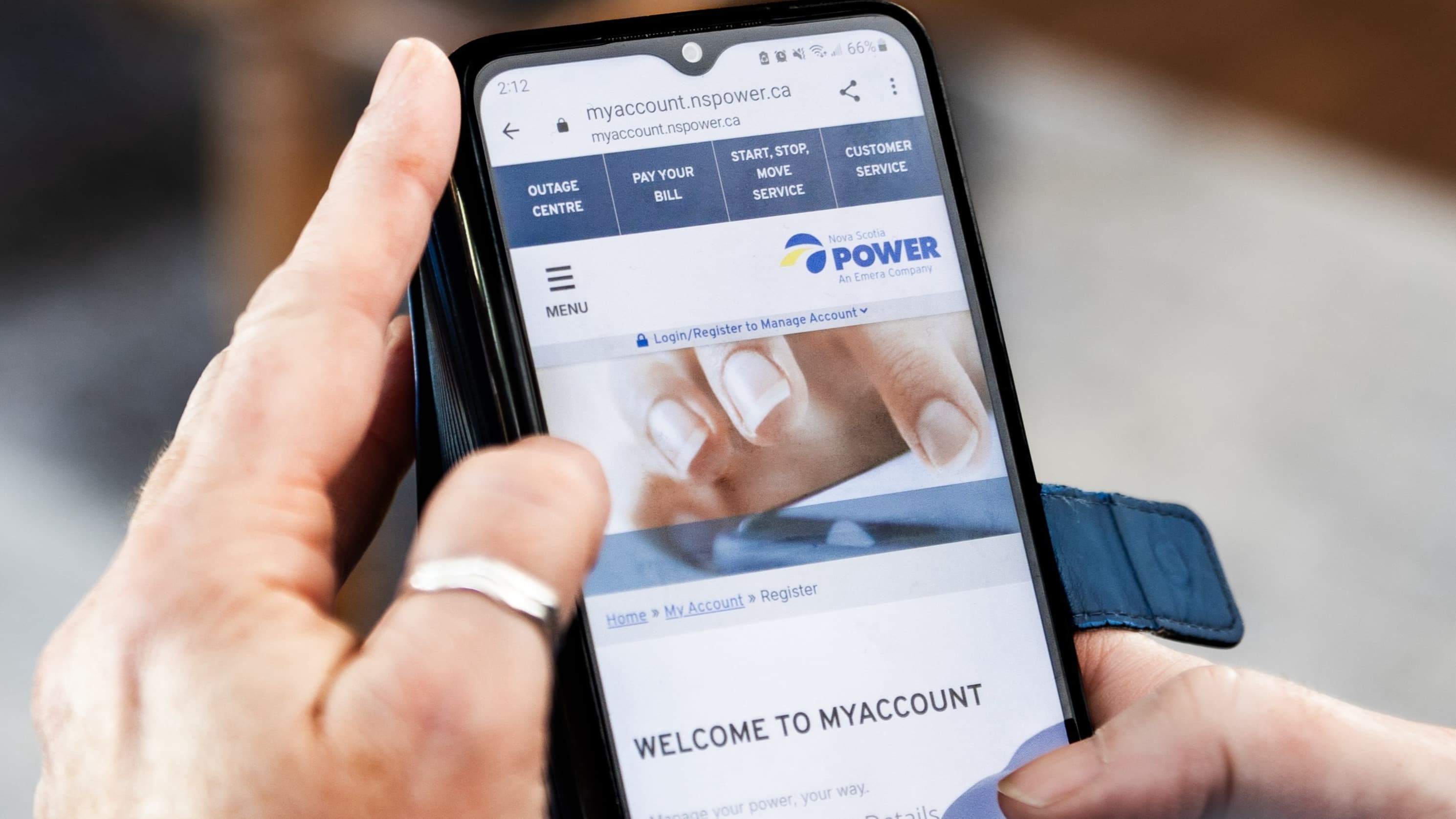A phone showing the MyAccount login screen